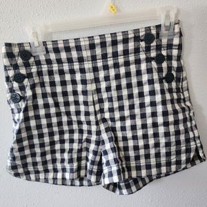 LOFT size 0 navy and white sailor button side zip shorts.